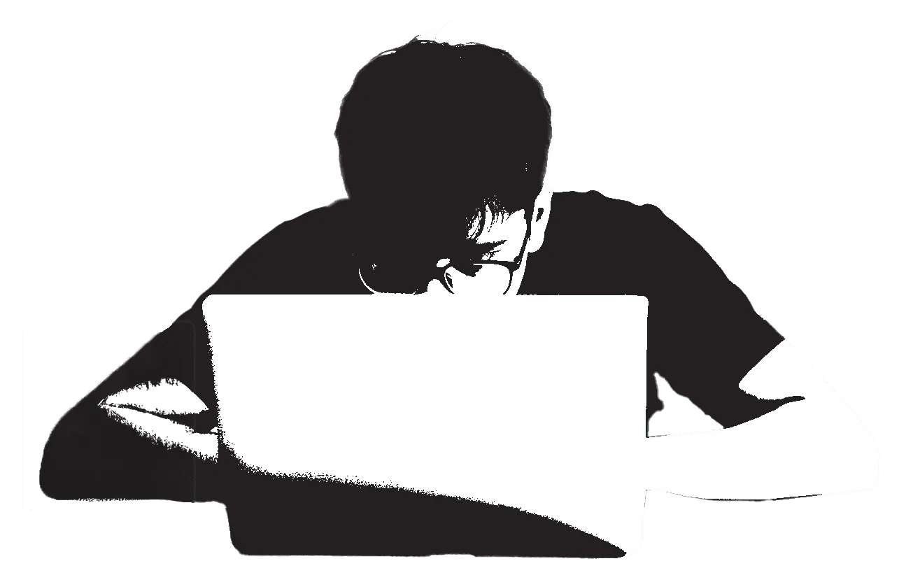 Reading through Carvaan reviews on a laptop
